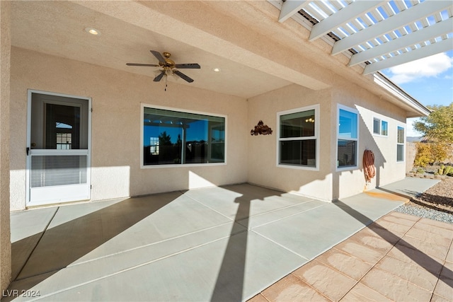 view of patio featuring a pergola and ceiling fan