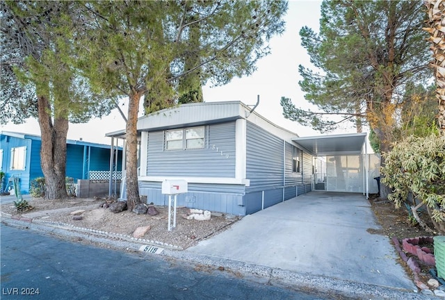 manufactured / mobile home with a carport