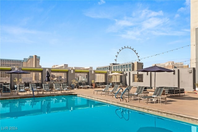 view of swimming pool featuring a patio area