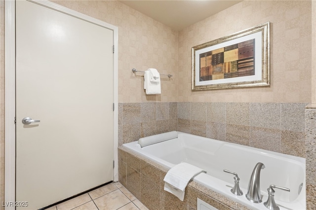 full bathroom with tile patterned flooring and a bath