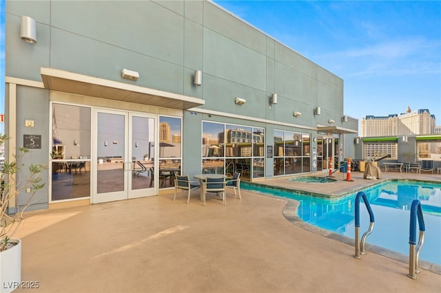 pool with a patio area