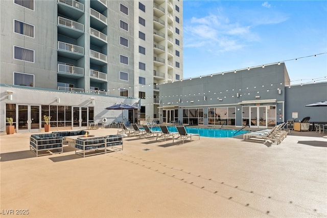 community pool with a patio