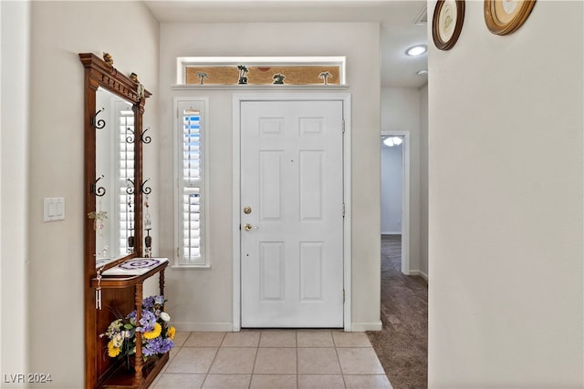 view of carpeted foyer