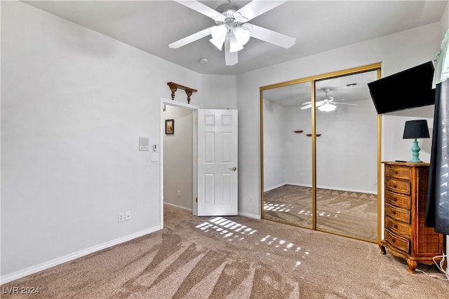 unfurnished bedroom with carpet floors, a closet, and ceiling fan