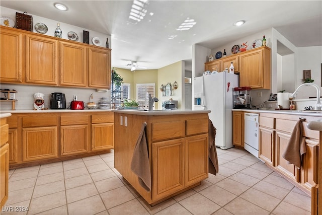 kitchen with light tile patterned floors, white appliances, ceiling fan, and sink