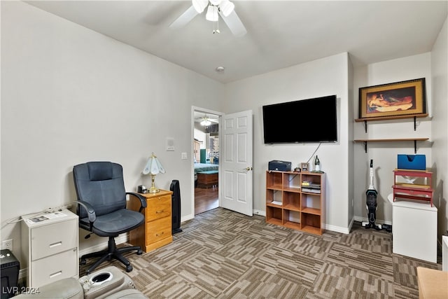 office space featuring carpet and ceiling fan