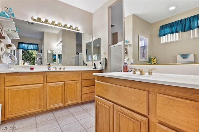 bathroom featuring tile patterned flooring and vanity