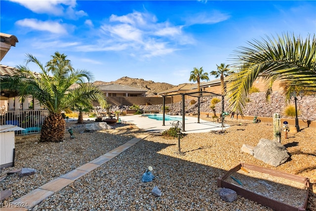 exterior space with a patio and a fenced in pool