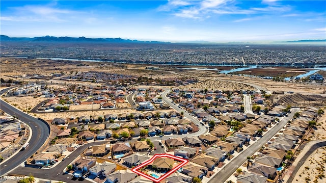 birds eye view of property featuring a mountain view