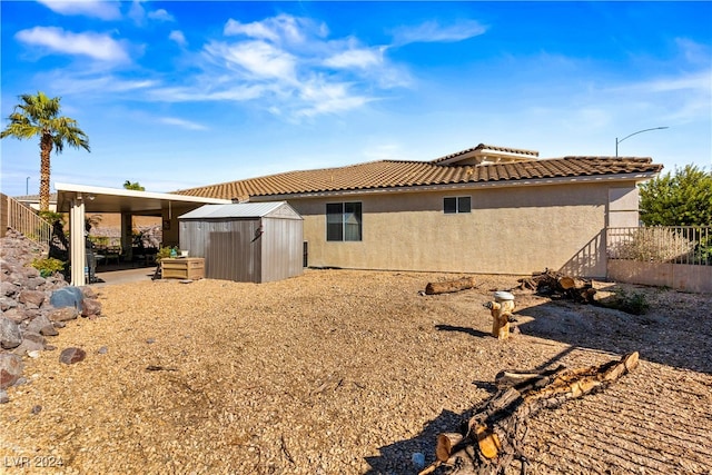 back of property with a storage unit