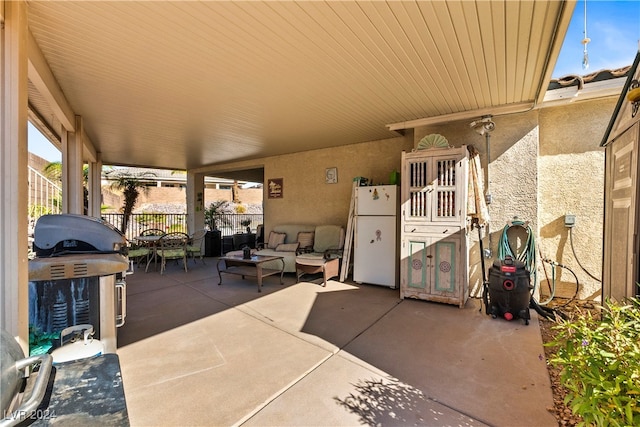 view of patio / terrace with outdoor lounge area and a grill