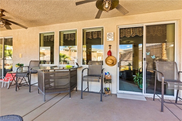 view of patio featuring ceiling fan