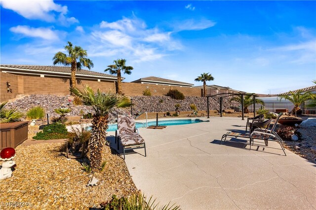 view of swimming pool with a patio area