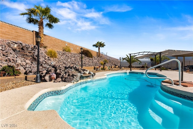 view of pool featuring pool water feature