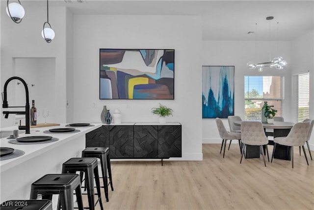 dining area with light hardwood / wood-style floors