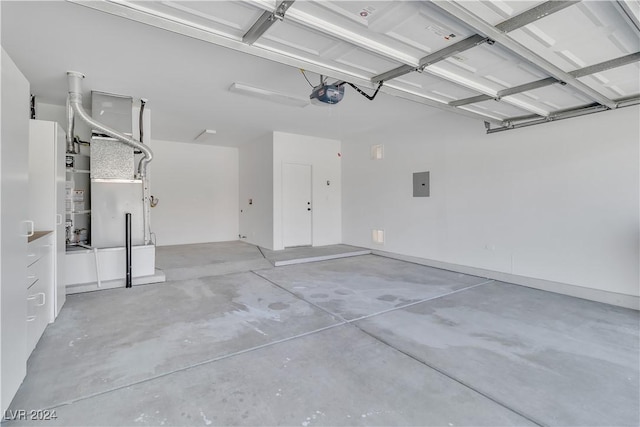 garage with secured water heater, electric panel, and a garage door opener