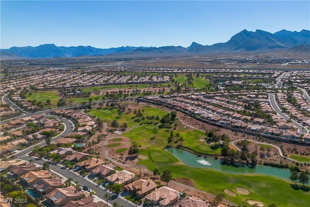 birds eye view of property with a water and mountain view