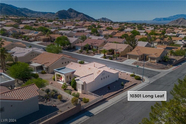 birds eye view of property with a mountain view