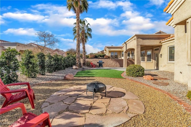 view of patio featuring a fire pit