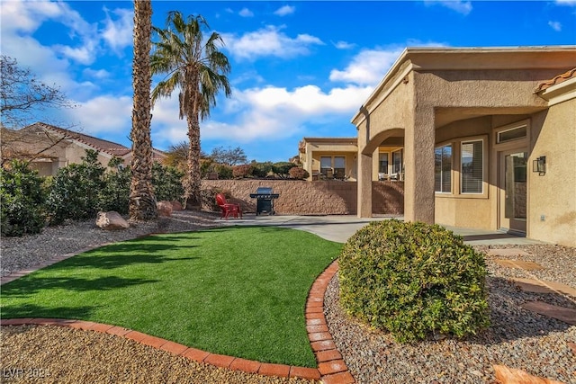 view of yard with a patio area