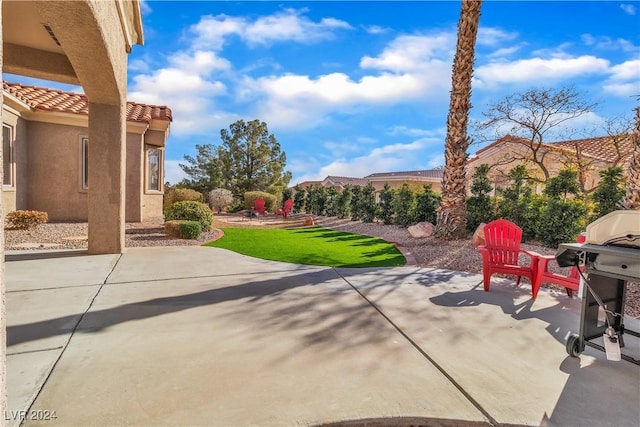 view of patio featuring a grill