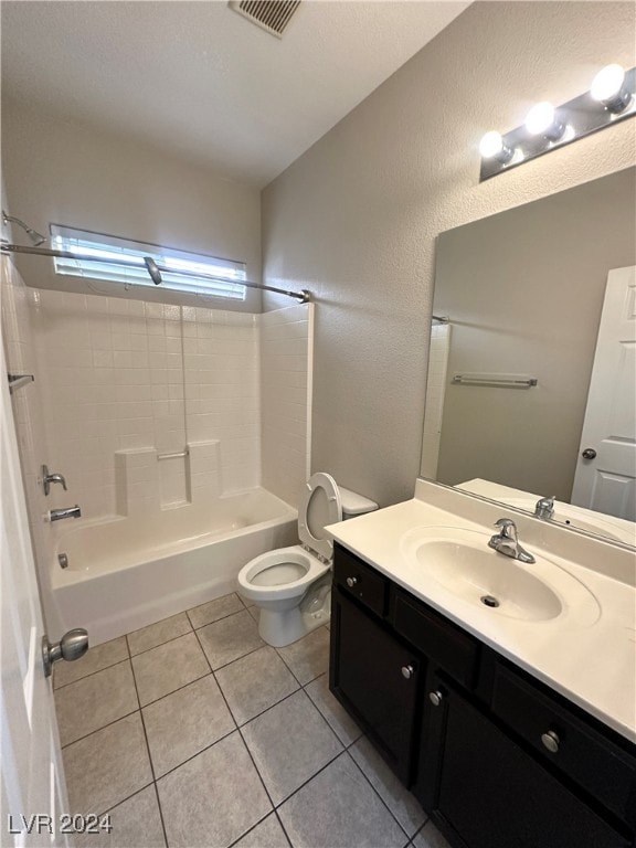 full bathroom featuring tile patterned flooring, vanity,  shower combination, and toilet