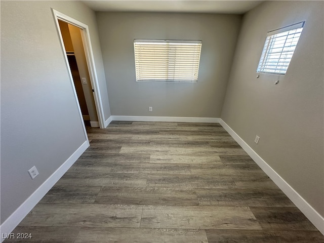 spare room featuring dark wood-type flooring