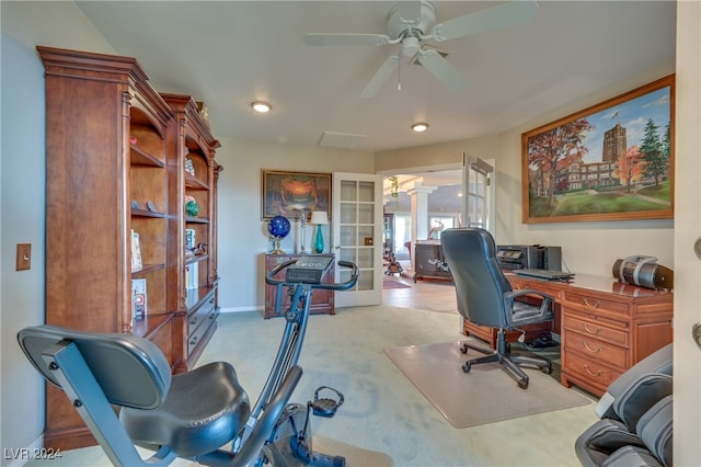 carpeted office space featuring ceiling fan and french doors