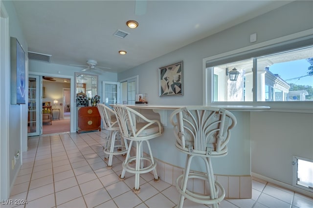 kitchen with ceiling fan and light tile patterned floors