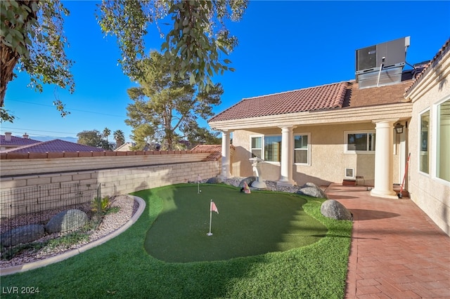 view of yard with a patio and central AC