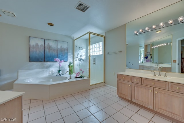 bathroom with tile patterned floors, vanity, and plus walk in shower