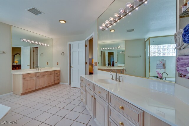 bathroom with tile patterned flooring and vanity