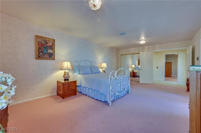 carpeted bedroom with a closet