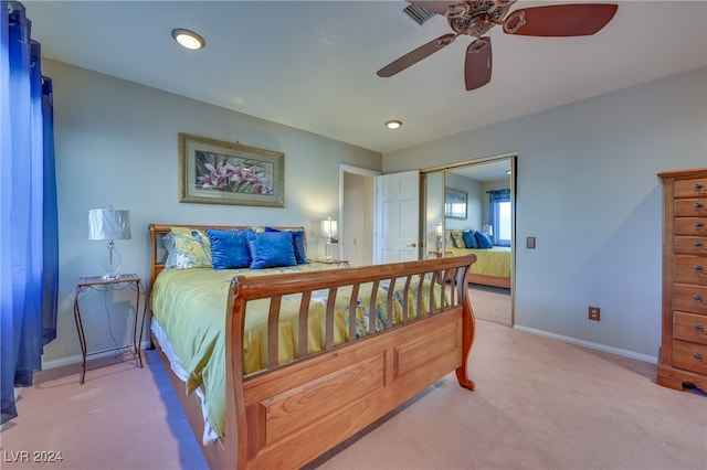 bedroom with carpet flooring, a closet, and ceiling fan