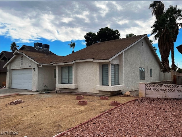 view of front of property with a garage