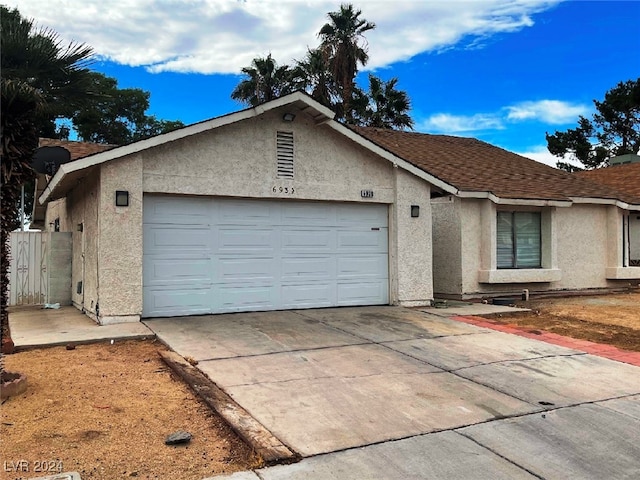 ranch-style house featuring a garage