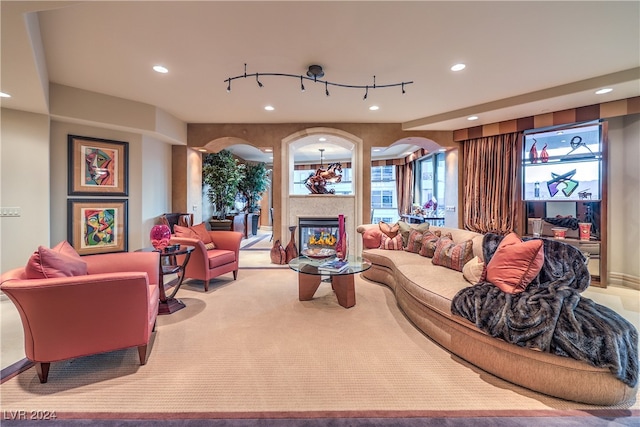 carpeted living room with a healthy amount of sunlight