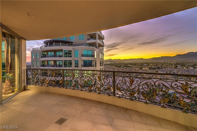 balcony at dusk with a mountain view