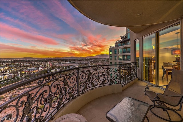 view of balcony at dusk