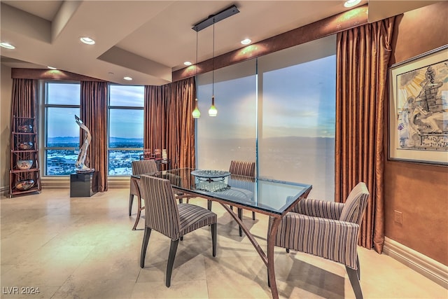 dining space featuring a wall of windows