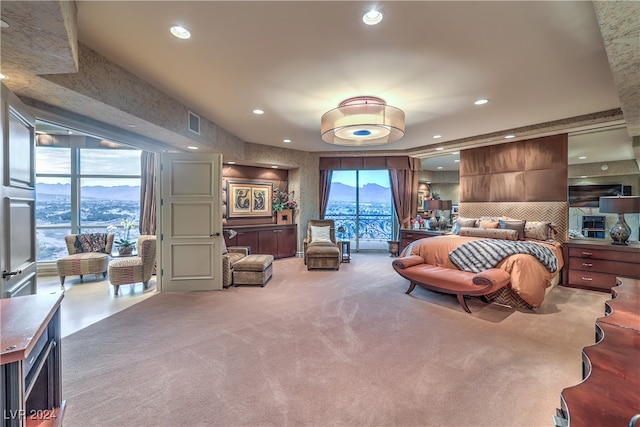 bedroom featuring a mountain view and carpet floors