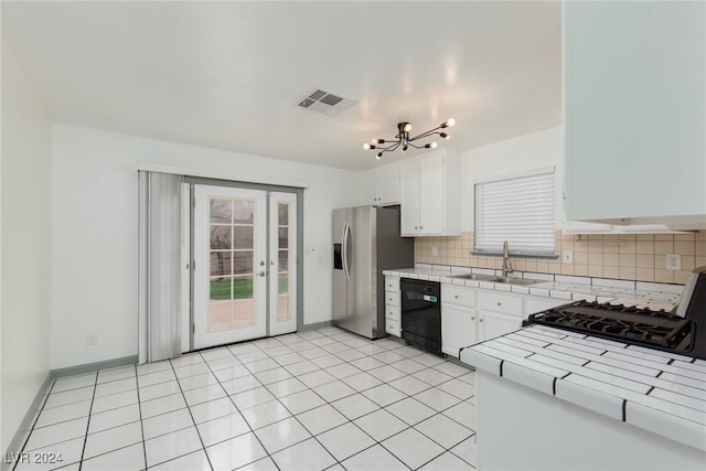 kitchen featuring white cabinetry, dishwasher, sink, tile counters, and stainless steel refrigerator with ice dispenser