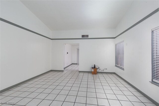 spare room with light tile patterned floors