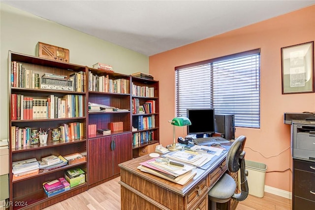 office space with light wood-type flooring