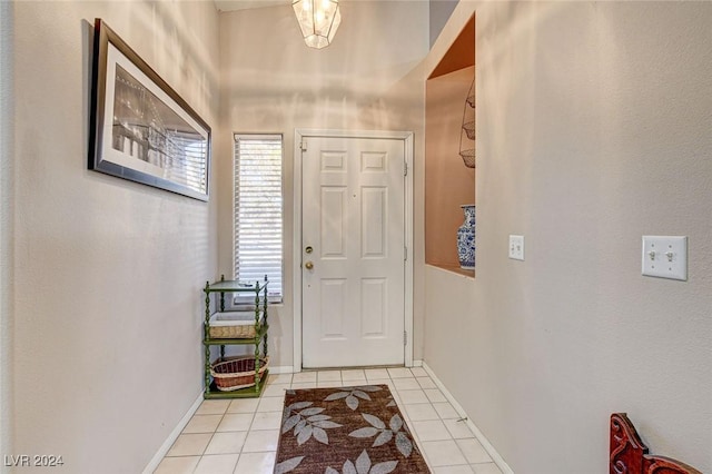 doorway featuring light tile patterned floors