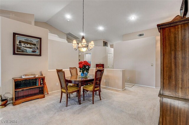 carpeted dining area featuring lofted ceiling and a notable chandelier