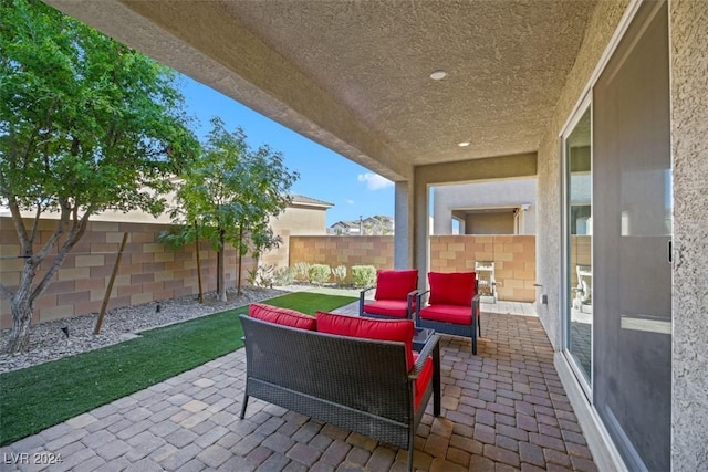 view of patio with a fenced backyard and outdoor lounge area