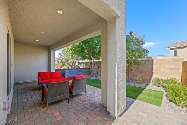 view of patio with an outdoor living space and a fenced backyard