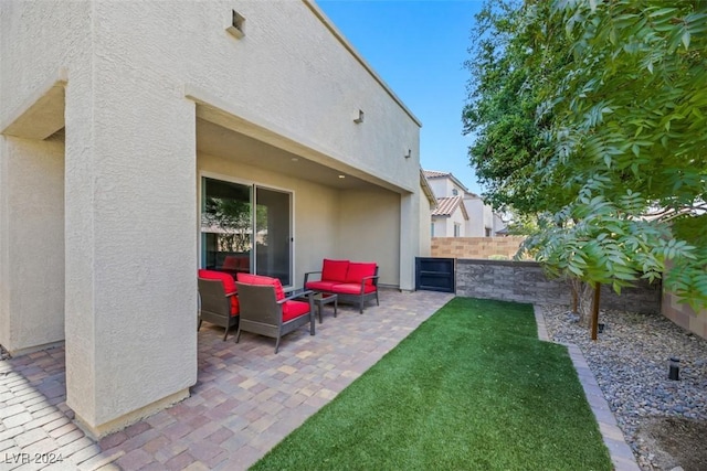 view of patio featuring an outdoor hangout area and a fenced backyard