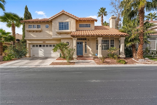 mediterranean / spanish-style house featuring a garage